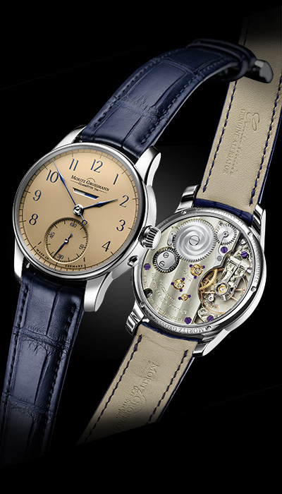 GANGRESERVE<br />
mit lachsfarbenem Zifferblatt